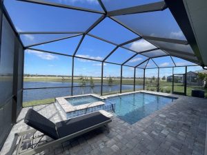 relaxing swimming pool with view of lake in new construction brightmore wellen park by mattamy homes