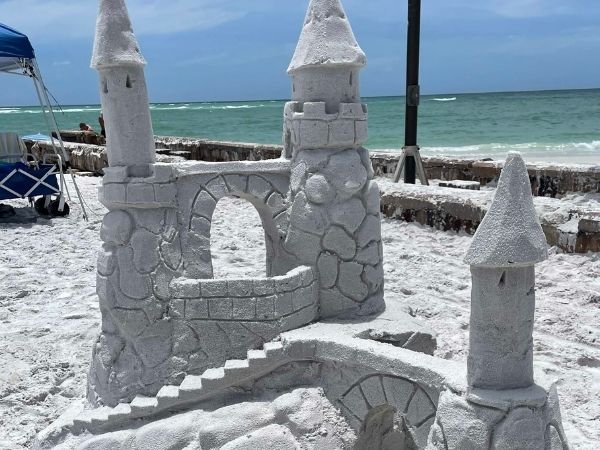 extravagant sand castle with spires and bridges