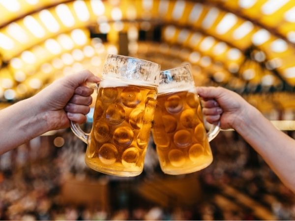 two beer glasses celebrate oktoberfest tampa
