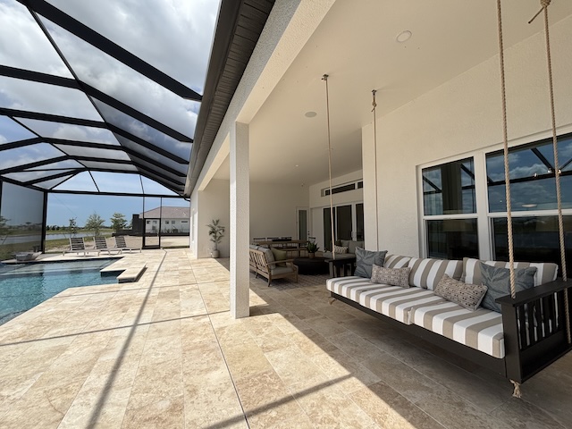 Wellen Park Builders: Your BEST Guide to New Construction Builders & Resale Home Communities 13 M/I new construction home wellen park builders sactuary model back lanai with swing overlooking pool new construction homes wellen park