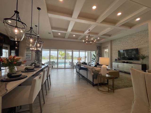 Wellen Park Builders: Your BEST Guide to New Construction Builders & Resale Home Communities 18 homes by westbay biscayne II model home in everly wellen park grand living area with custom ceiling and large glass sliders semi custom wellen park builders new construction homes in wellen park