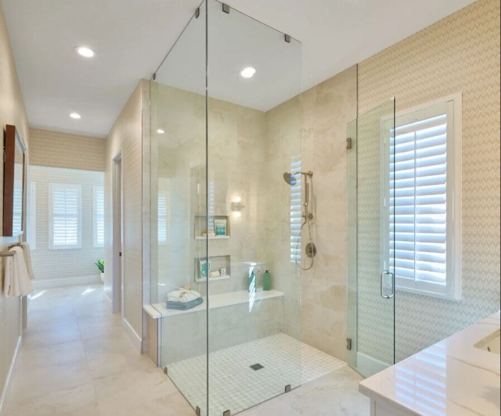 custom designed bathroom with large walk-in shower with full length glass panels