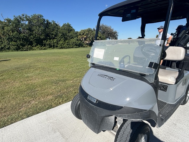josh at esplanade with a golf cart